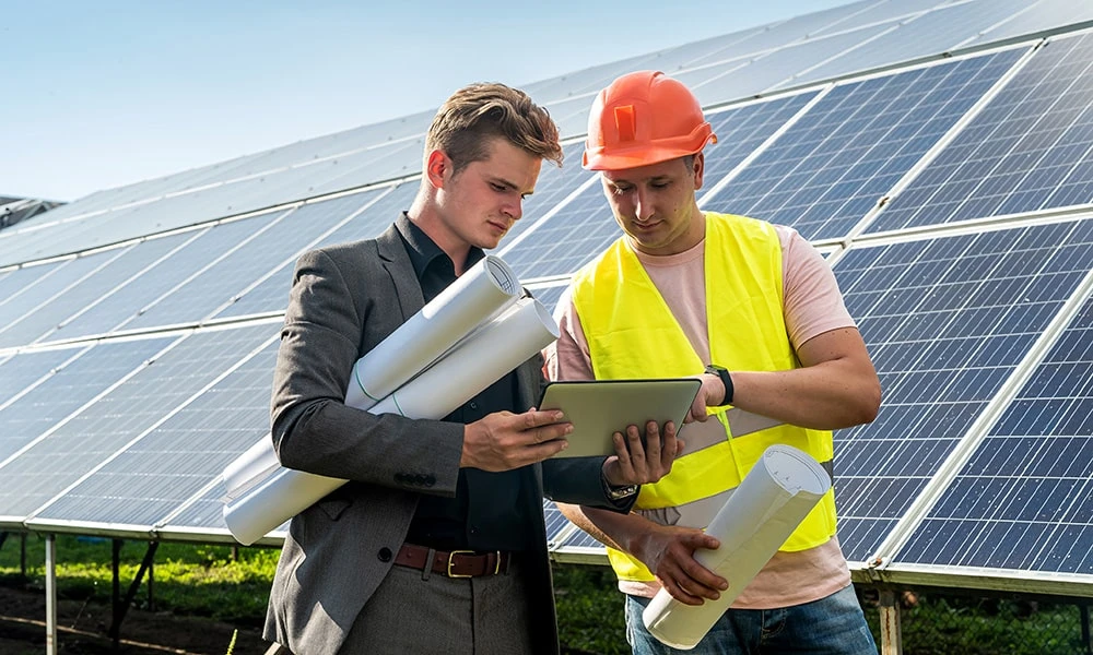 Solar professionals reviewing project plans